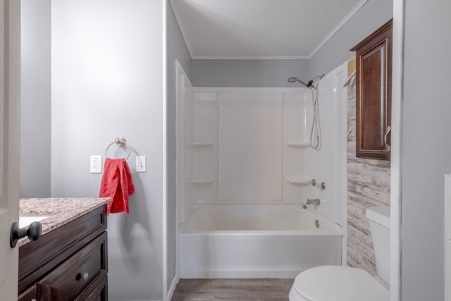 full bath with ornamental molding, wood finished floors, toilet, vanity, and shower / washtub combination