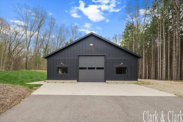 detached garage featuring driveway