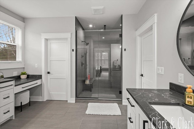 full bath featuring recessed lighting, baseboards, a shower stall, and vanity