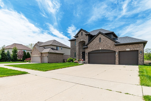 12474 Clinton River Rd, Sterling Heights, MI 48313 - french provincial home featuring brick siding, a front yard, a garage, driveway, and roof with shingles