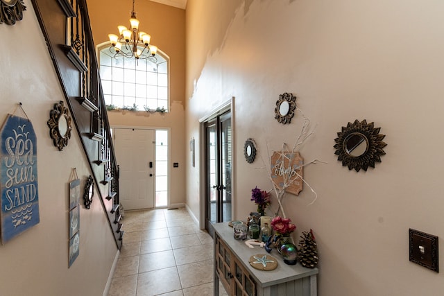 12474 Clinton River Rd, Sterling Heights, MI 48313 - foyer featuring a chandelier, light tile patterned floors, baseboards, and a high ceiling
