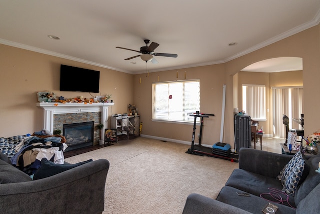 12474 Clinton River Rd, Sterling Heights, MI 48313 - living room with arched walkways, ceiling fan, a stone fireplace, baseboards, and ornamental molding