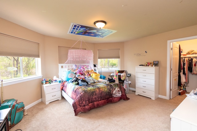 12474 Clinton River Rd, Sterling Heights, MI 48313 - bedroom with light colored carpet, baseboards, and a walk in closet