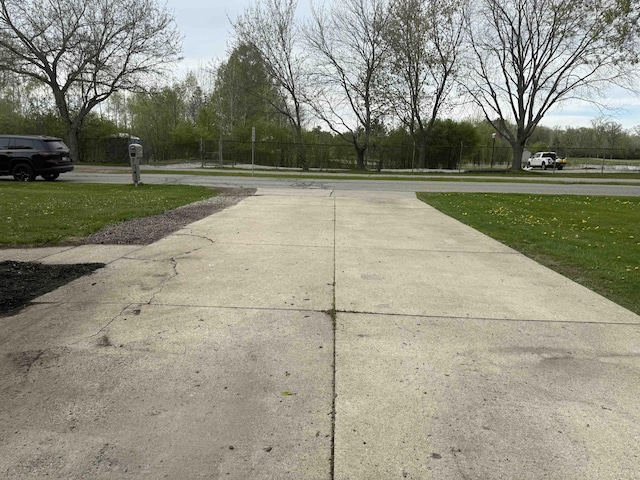 view of street with concrete driveway