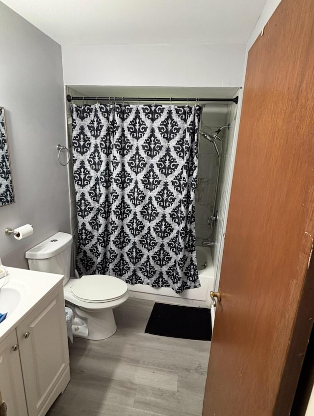 19351 Filmore St, Southfield, MI 48075 - full bathroom with vanity, shower / bath combination with curtain, and wood finished floors