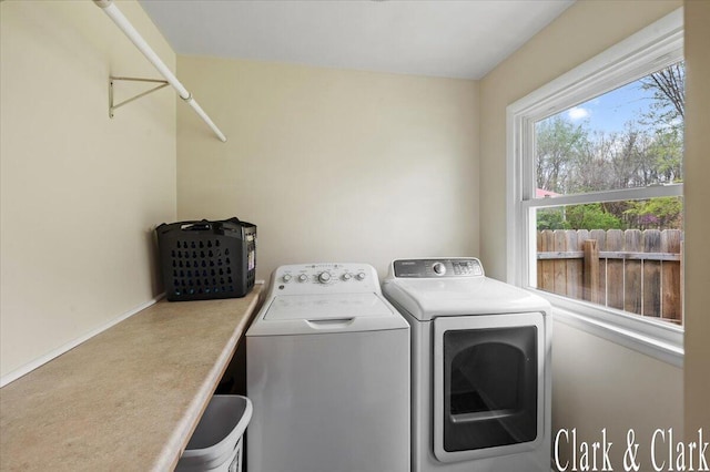 clothes washing area with laundry area and washing machine and clothes dryer