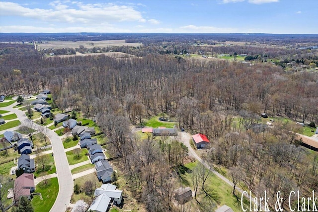 bird's eye view featuring a wooded view