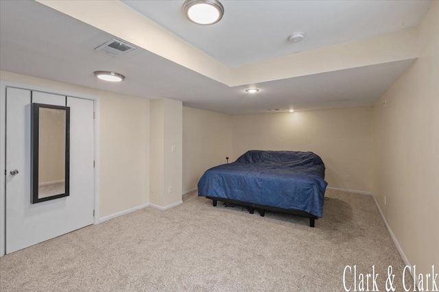 bedroom with carpet floors, baseboards, and visible vents