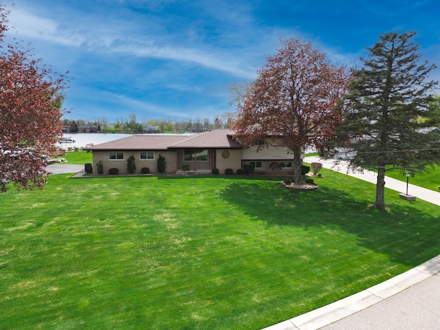 9145 Sandy Ridge Dr, White Lake, MI 48386 - ranch-style home with a chimney, a water view, and a front lawn