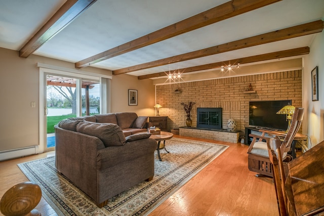 9145 Sandy Ridge Dr, White Lake, MI 48386 - living area featuring beam ceiling, wood finished floors, a fireplace, baseboard heating, and brick wall