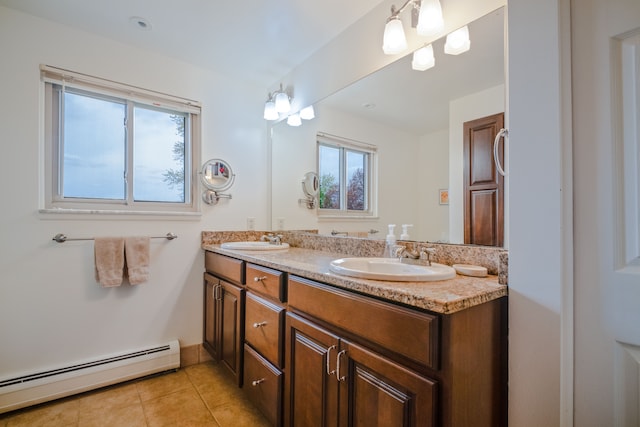 9145 Sandy Ridge Dr, White Lake, MI 48386 - bathroom with tile patterned flooring, baseboard heating, double vanity, and a sink