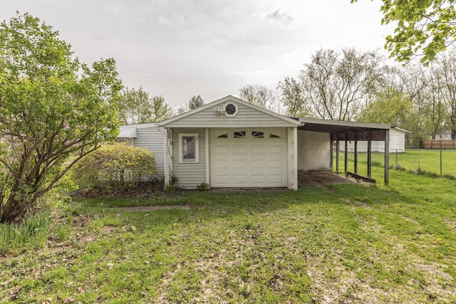 view of outbuilding featuring an attached garage, fence, and driveway