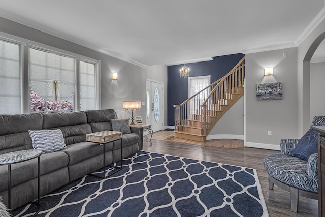 37 N Monroe St, Coldwater, MI 49036 - living area with an inviting chandelier, crown molding, wood finished floors, stairway, and arched walkways