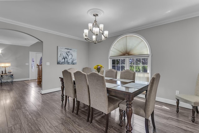 37 N Monroe St, Coldwater, MI 49036 - dining room featuring arched walkways, baseboards, wood finished floors, and a chandelier