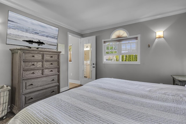 37 N Monroe St, Coldwater, MI 49036 - bedroom featuring crown molding, baseboards, and wood finished floors