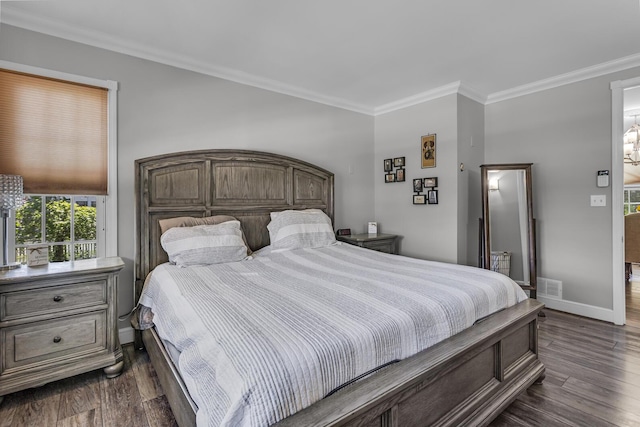 37 N Monroe St, Coldwater, MI 49036 - bedroom with baseboards, ornamental molding, dark wood finished floors, and visible vents