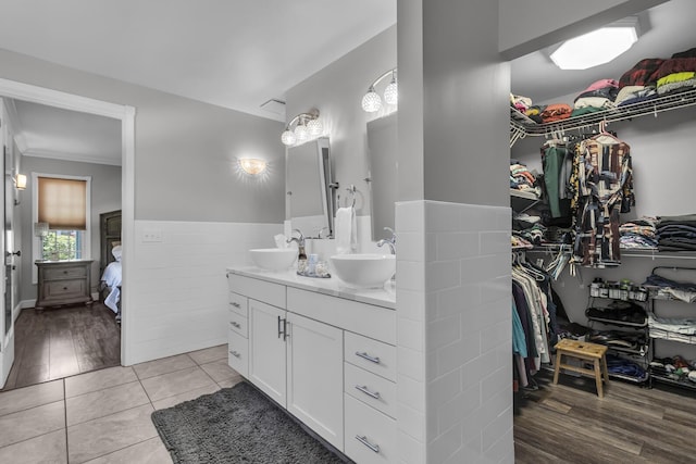 37 N Monroe St, Coldwater, MI 49036 - ensuite bathroom featuring a sink, a spacious closet, double vanity, and connected bathroom