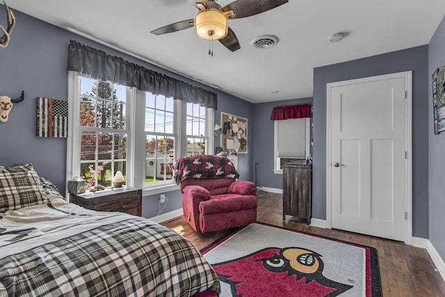 37 N Monroe St, Coldwater, MI 49036 - bedroom with baseboards, ceiling fan, visible vents, and hardwood / wood-style floors