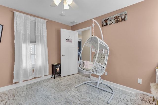 37 N Monroe St, Coldwater, MI 49036 - living area featuring baseboards, ceiling fan, wood finished floors, and visible vents