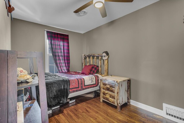 37 N Monroe St, Coldwater, MI 49036 - bedroom featuring baseboards, a ceiling fan, wood finished floors, and visible vents