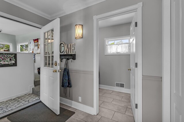 37 N Monroe St, Coldwater, MI 49036 - interior space featuring baseboards, crown molding, tile patterned floors, and visible vents