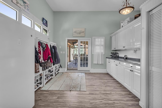 37 N Monroe St, Coldwater, MI 49036 - mudroom with a towering ceiling, baseboards, french doors, and wood finished floors