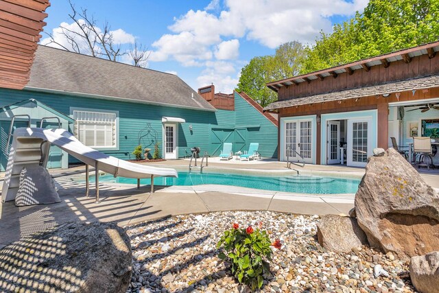 37 N Monroe St, Coldwater, MI 49036 - pool featuring french doors, a patio, and a water slide