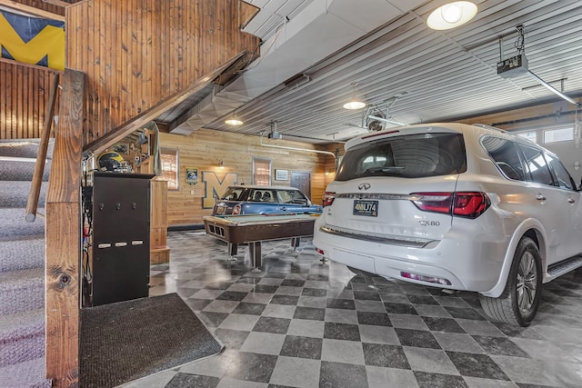 37 N Monroe St, Coldwater, MI 49036 - rec room with dark floors, billiards, wood walls, and a garage