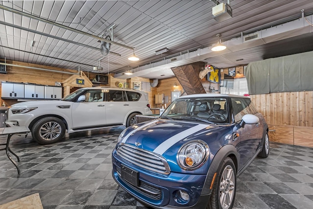 37 N Monroe St, Coldwater, MI 49036 - garage featuring wooden walls and visible vents