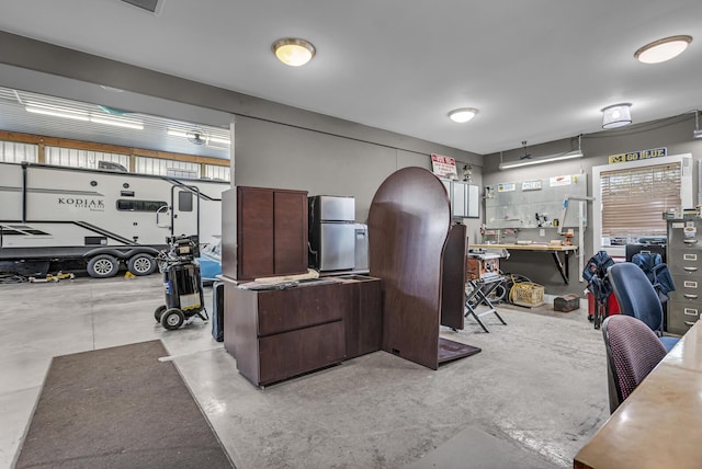 37 N Monroe St, Coldwater, MI 49036 - office featuring concrete floors, a healthy amount of sunlight, and a workshop area