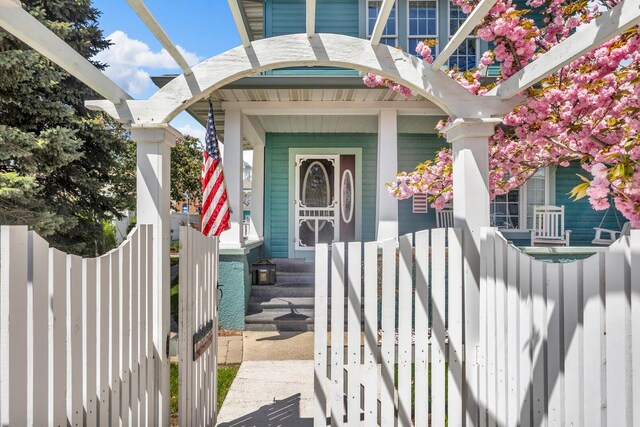 37 N Monroe St, Coldwater, MI 49036 - view of exterior entry featuring fence and covered porch