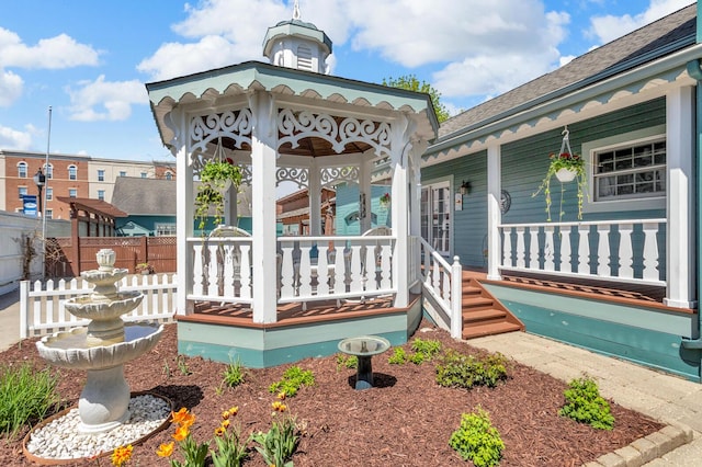 37 N Monroe St, Coldwater, MI 49036 - view of exterior entry featuring a porch and fence