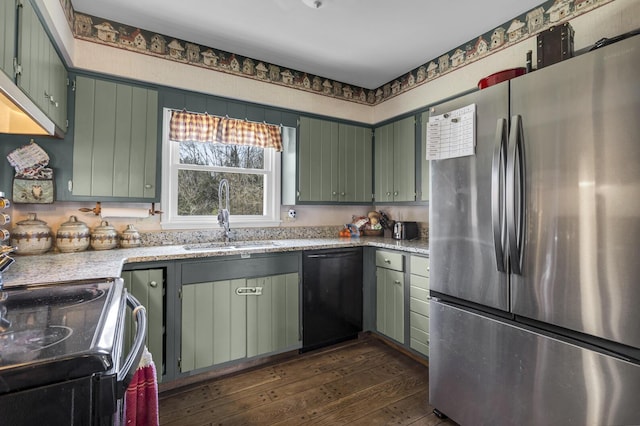 9875 Rountree Rd, Hanover, MI 49241 - kitchen with light stone counters, a sink, dark wood-style floors, black appliances, and green cabinets