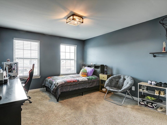 carpeted bedroom with baseboards