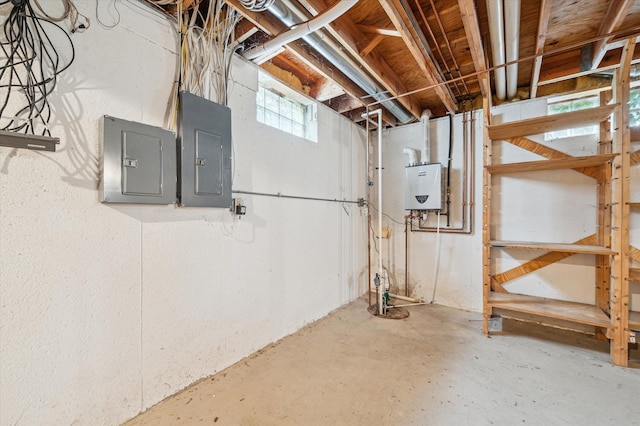 below grade area featuring electric panel and water heater