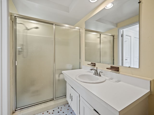 full bathroom with a shower stall, tile patterned floors, and vanity