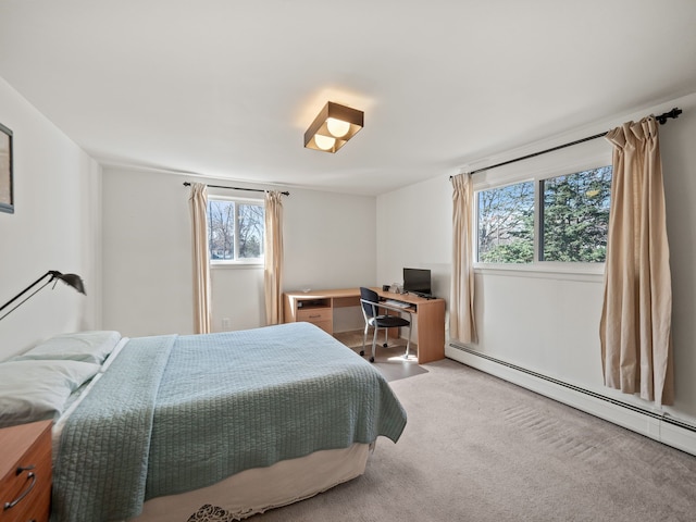 bedroom with multiple windows, baseboard heating, and carpet floors