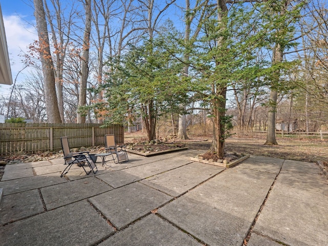 view of patio / terrace featuring fence