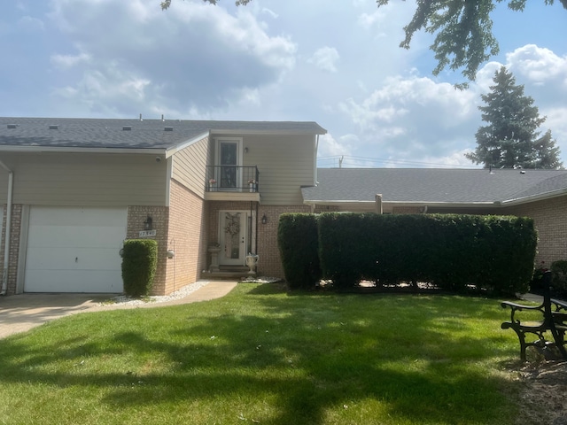 17540 Edward Cir, Clinton Township, MI 48038 - rear view of property featuring a balcony, brick siding, a lawn, and a garage