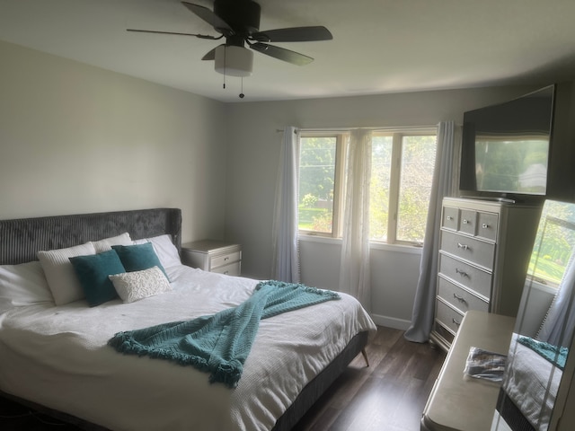 17540 Edward Cir, Clinton Township, MI 48038 - bedroom with dark wood-style floors, ceiling fan, and baseboards