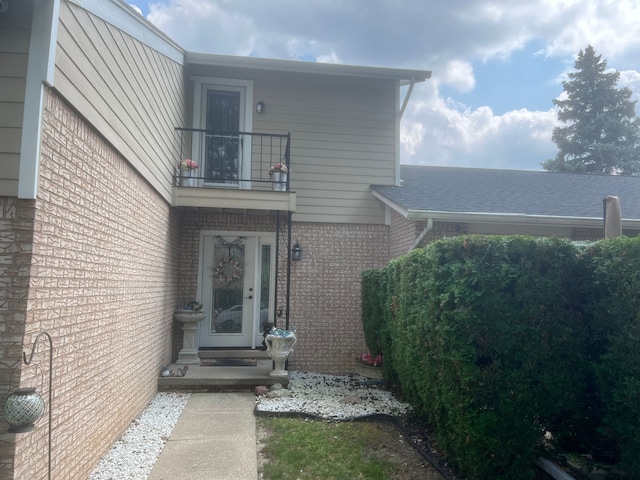 17540 Edward Cir, Clinton Township, MI 48038 - entrance to property with brick siding and a balcony