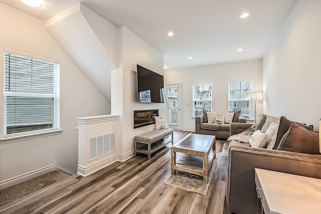587 Anne Ave, Brighton, MI 48116 - living area with dark wood finished floors, baseboards, and recessed lighting