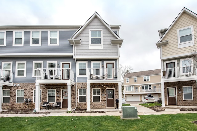 587 Anne Ave, Brighton, MI 48116 - view of front of property featuring cooling unit and a front lawn