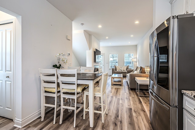 587 Anne Ave, Brighton, MI 48116 - dining space with baseboards, recessed lighting, and light wood-type flooring