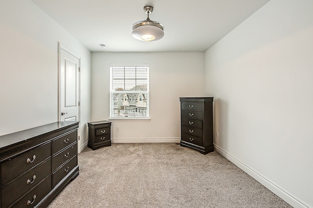 587 Anne Ave, Brighton, MI 48116 - unfurnished bedroom with light carpet and baseboards