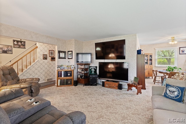 1402 Westhaven Blvd, Tecumseh, MI 49286 - carpeted living area with stairway and ceiling fan