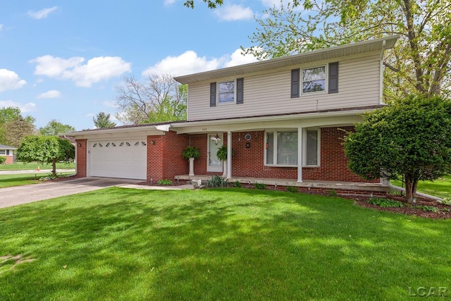 1402 Westhaven Blvd, Tecumseh, MI 49286 - view of front of home with an attached garage, brick siding, driveway, and a front yard