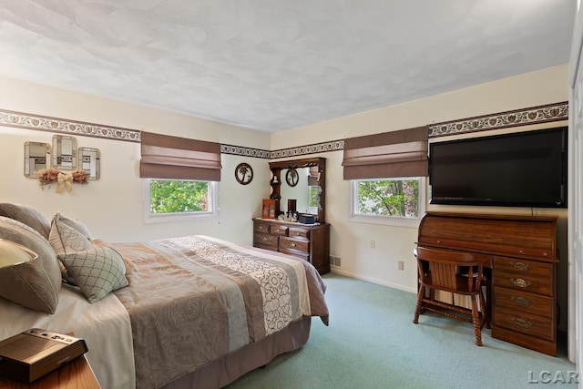 1402 Westhaven Blvd, Tecumseh, MI 49286 - carpeted bedroom featuring multiple windows and baseboards