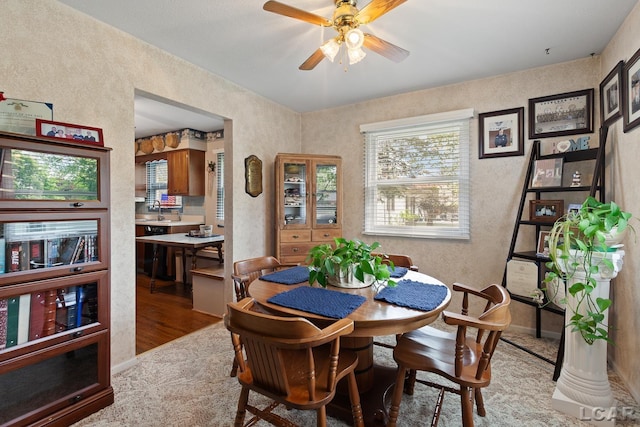 1402 Westhaven Blvd, Tecumseh, MI 49286 - dining room featuring a ceiling fan, a textured wall, and light wood-type flooring