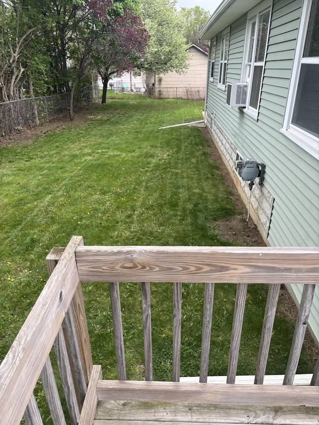view of yard featuring fence and cooling unit